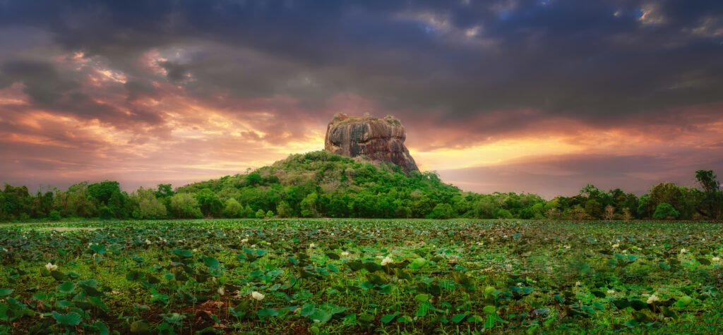 Wide-angle shot of Sigiriya Rock Fortress at sunrise
