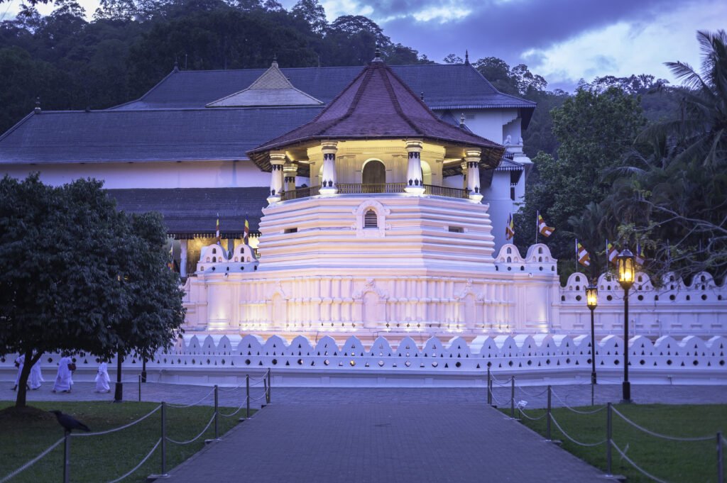 The revered Temple of the Sacred Tooth Relic illuminated at night in Kandy