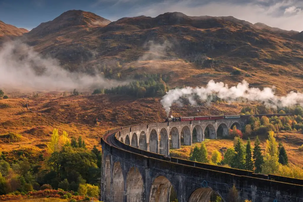 The Ultimate 14-Day Itinerary for a Road Trip Through Scotland 4 Panoramic view of Glenfinnan Viaduct with steam train crossing